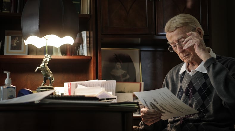 Oscar Soifer, 95, was a veteran of the Pacific theater in World War II. Oscar's office in Dayton is filled with pictures that bring back memories of the counties historic past. JIM NOELKER/STAFF