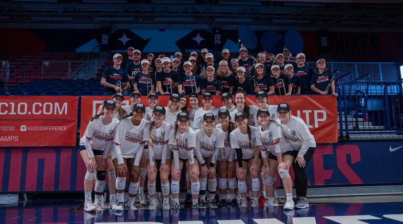 Dayton celebrates after winning the Atlantic 10 Conference volleyball tournament championship on Sunday, Nov. 21, 2021, at the UMPC Cooper Fieldhouse in Pittsburgh, Pa. Photo courtesy of Dayton Athletics