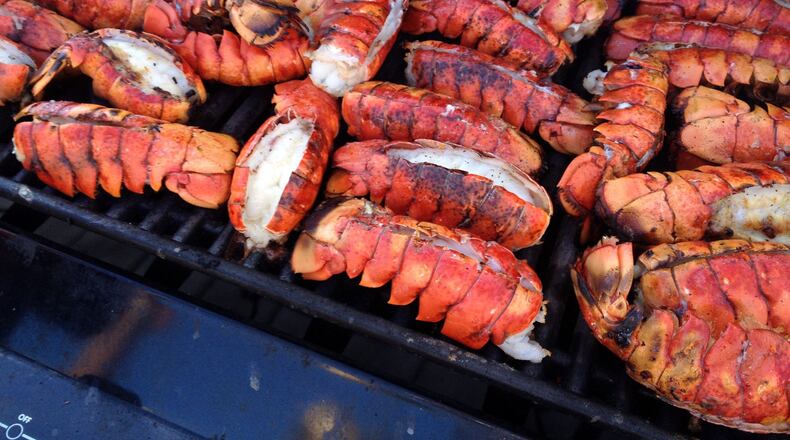 Lobster tails on the grill. When making a lobster bisque, you can cook the lobster and make the stock in advance. (Susan Selasky/Detroit Free Press/TNS)
