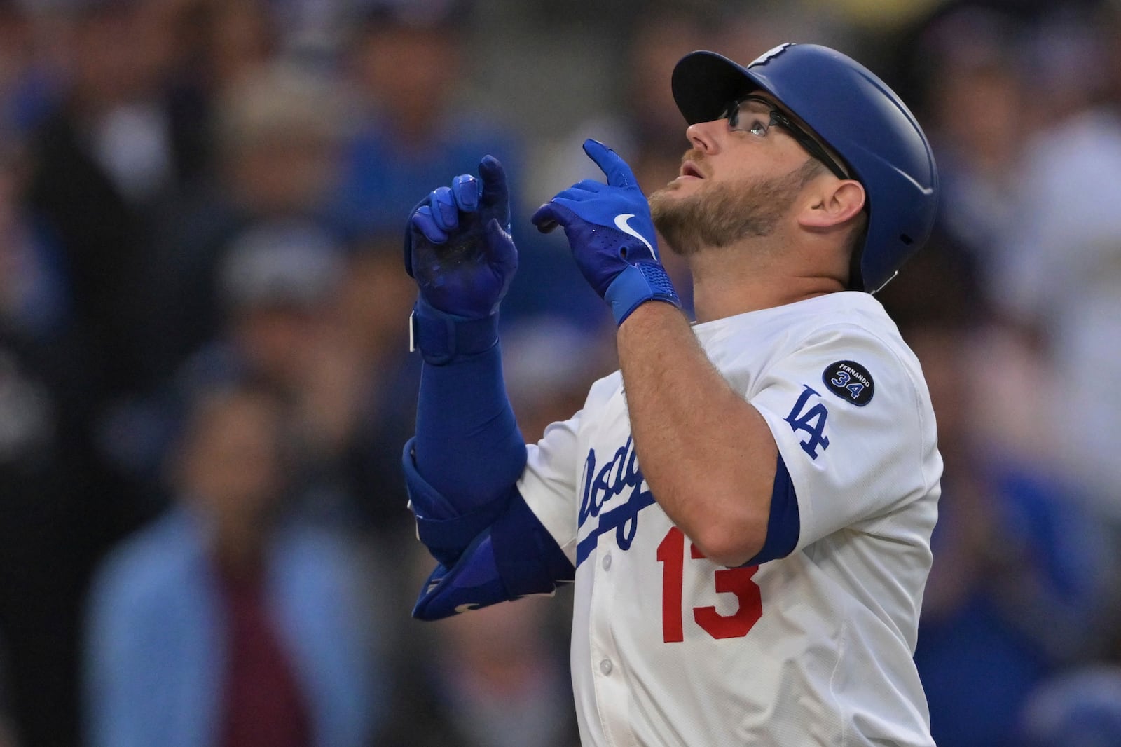 Los Angeles Dodgers' Max Muncy crosses the plate after hitting a two-run home run during the first inning of a baseball game against the New York Mets, Tuesday, June 3, 2025, in Los Angeles. (AP Photo/Jayne Kamin-Oncea)