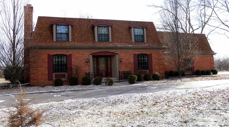 The 2-story Dutch colonial house sits on 2 acres at the end of a private cul-de-sac. The house, which has about 4,370 sq. ft. of living space, includes a full, semi-finished basement and 4 upstairs bedrooms. CONTRIBUTED PHOTOS BY KATHY TYLER