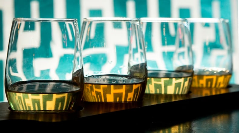 An Irish whiskey tasting, from left, of Tyrconnell, Redbreast, Knappogue Castle, Powers is set against a booth at Macallans Public House. The downtown Brea, Calif., gastropub offers 200 types of scotch, whiskey and bourbon, artisanal beers and crafted cocktails. (Cindy Yamanaka/Orange County Register/TNS)