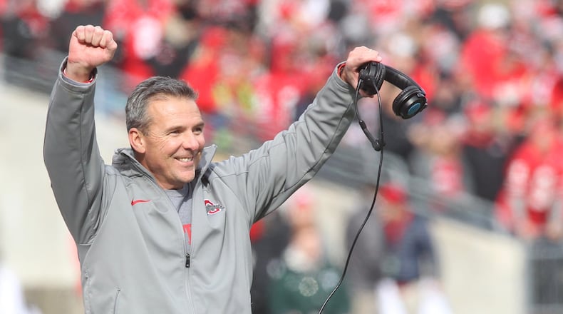 Ohio State's Urban Meyer smiles after a tackle by Ohio State's special teams against Michigan State on Saturday, Nov. 11, 2017, at Ohio Stadium in Columbus.