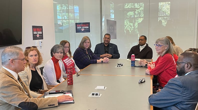 Ohio Governor candidate Nan Whaley met with former Dayton police chief Richard Biehl, Oregon District mass shooting survivor Dion Green and others Friday at the Dayton Metro Library main branch. / PARKER PERRY