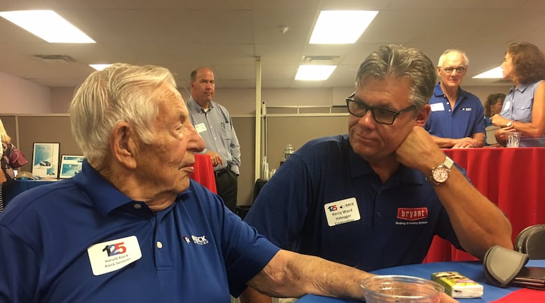 Former Rieck Services Owner Harold Riecker, left, talks with business associate and friend Kerry Ward in this undated file photo.