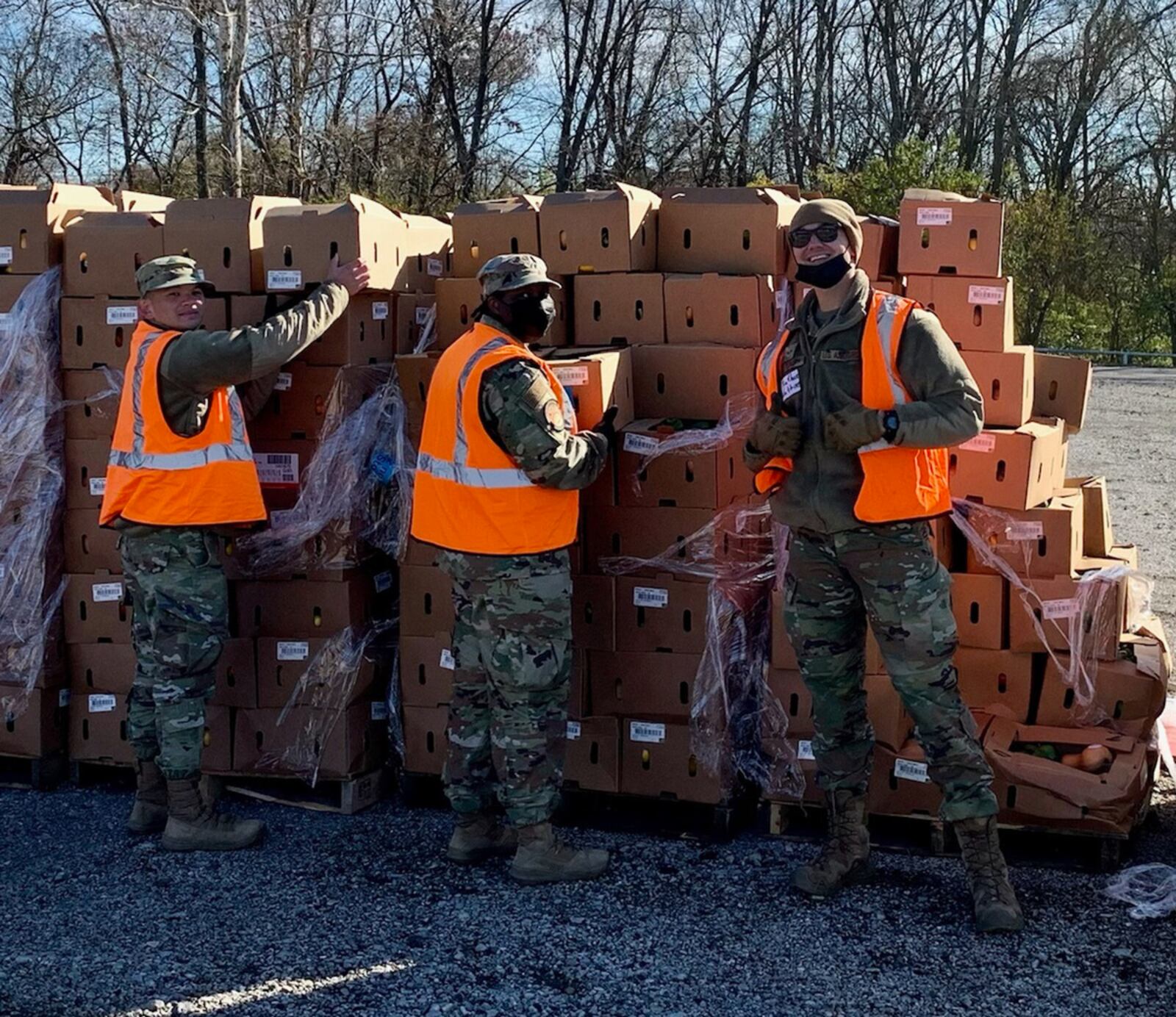 (From left) Airman 1st Class Jasper Kaamino, Staff Sgt. Stacy Thomas and Senior Airman Nathan Watkins prepare to hand out boxes of food as part of The Foodbank’s distribution Nov. 23. CONTRIBUTED PHOTO