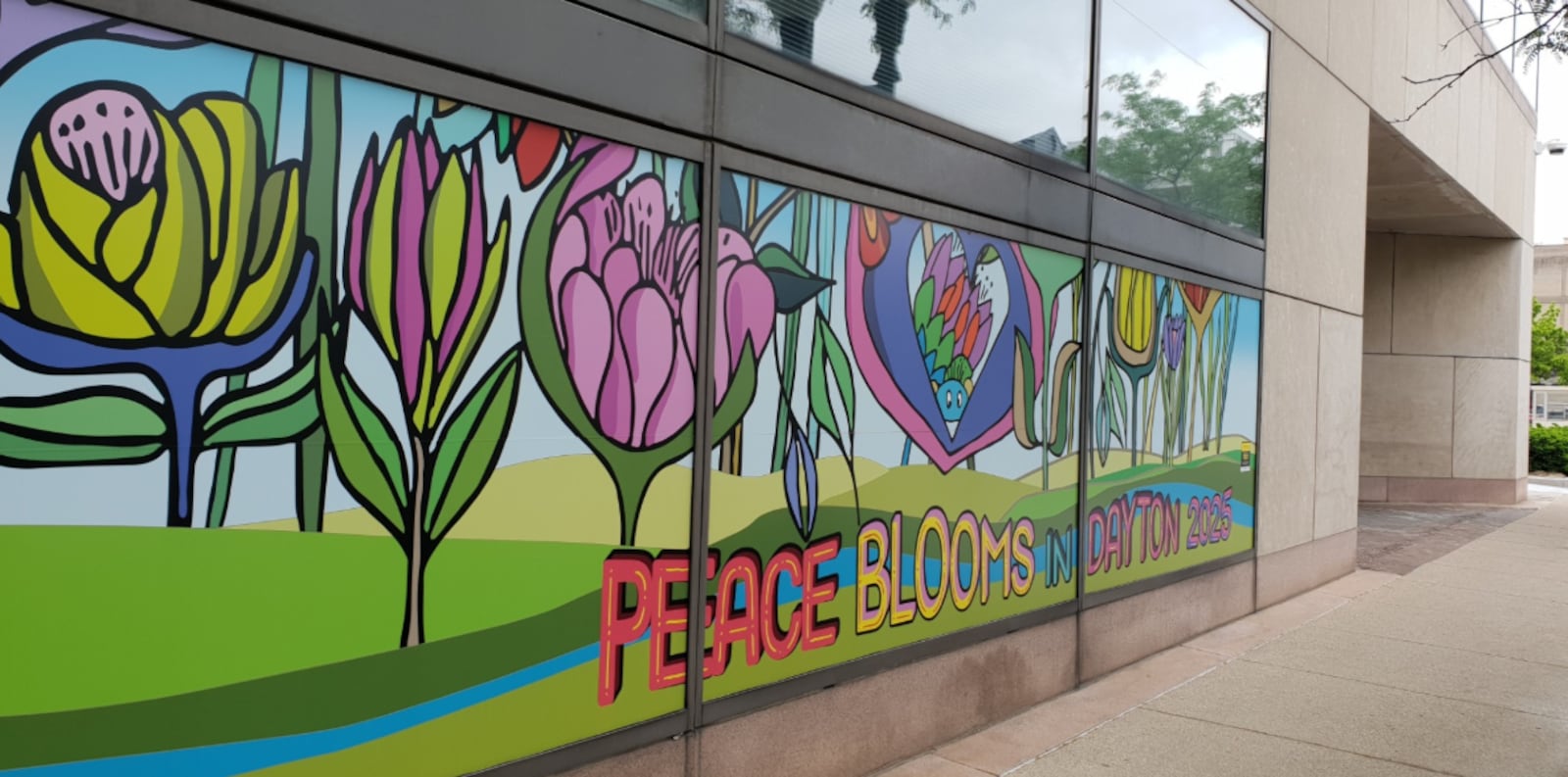 "Peace Blossoms in Dayton 2025" by Ching Chung pays homage to the Gem City’s historic role in the 1995 Dayton Peace Accords.  CONTRIBUTED