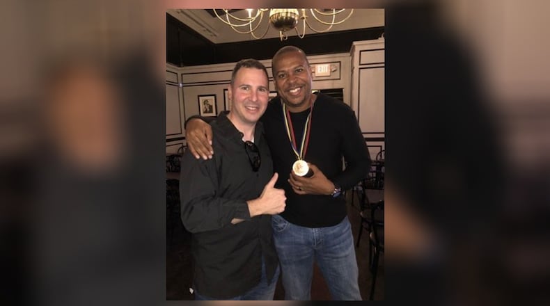 Dr. Martin Urban and Joe Greene, who’s wearing the bronze long jump medal he won at the 1992 Barcelona Olympics and Urban returned to him. CONTRIBUTED