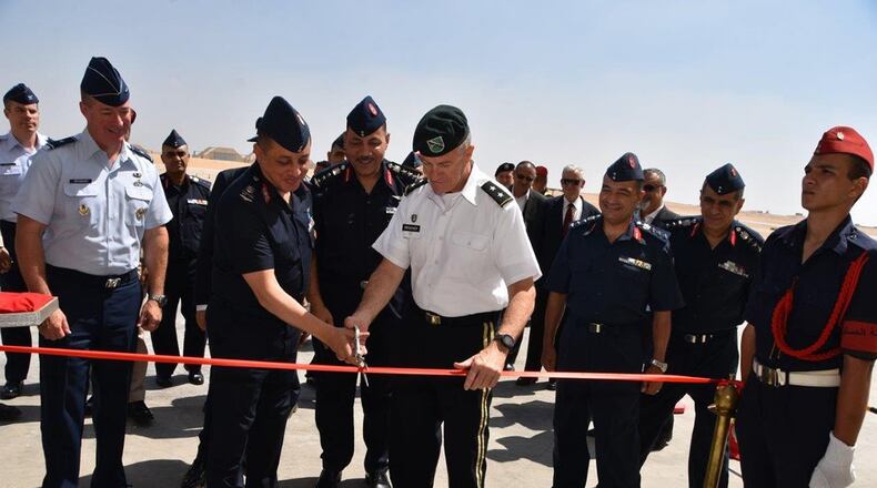 A ribbon-cutting ceremony at Cairo West Air Base, marking the completion of a $184 million construction project and delivery of 20 F-16s. U.S. Air Force Brig. Gen Brian Bruckbauer (left), director of the Air Force Security Assistance and Cooperation Directorate, and U.S. Army Maj. Gen. Ralph Groover III (middle right) the Senior Defense Official, United States Embassy, Cairo Egypt, attended the event.
