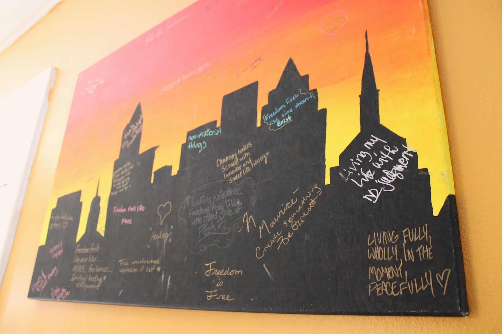 A painting adorns a wall at the Luv Locs Experiment Headquarters on Thursday, July 24. STAFF/SYDNEY DAWES