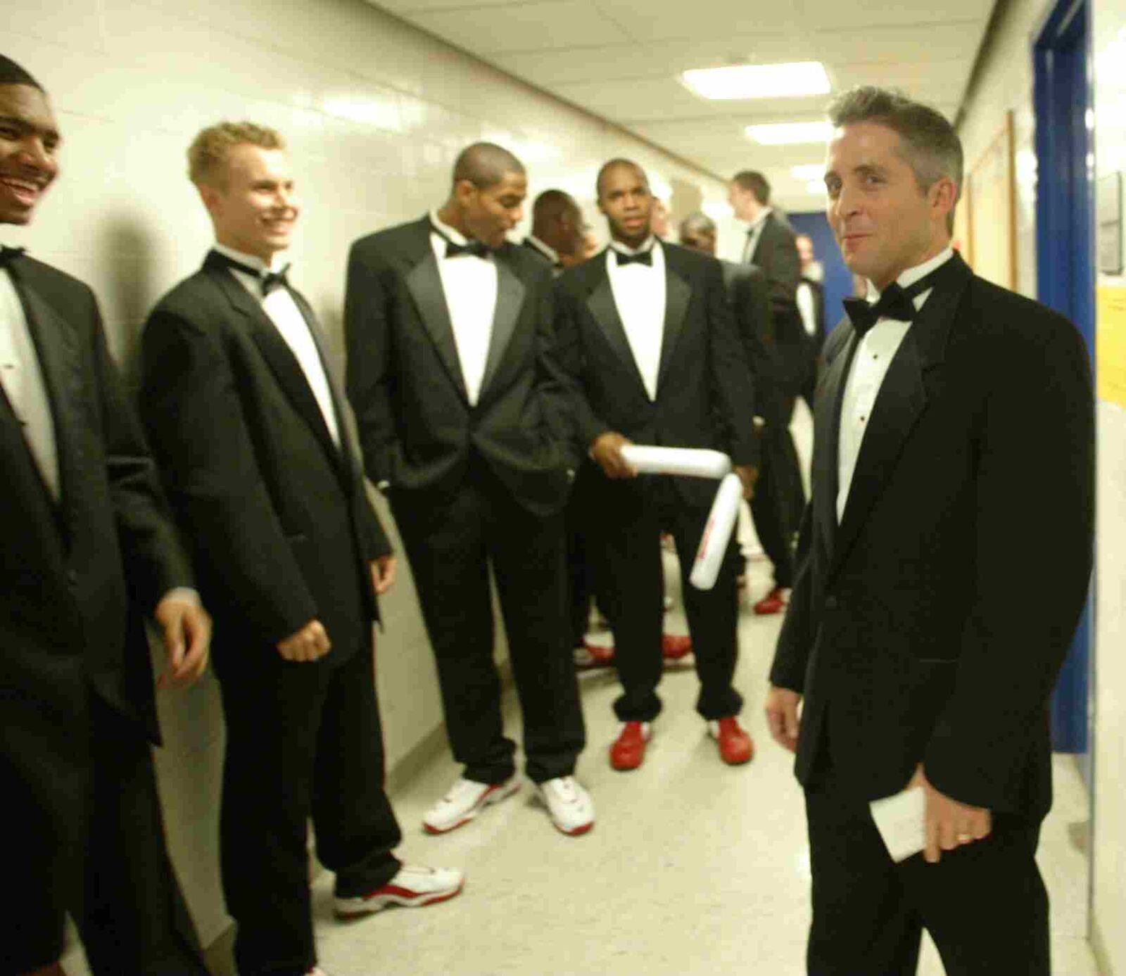 Brian Gregory (right), the new men's basketball coach at Dayton, is with his players prior to their introduction before the 2003 season. This was part of the Student Midnight Madness at Dayton. RON ALVEY / STAFF
