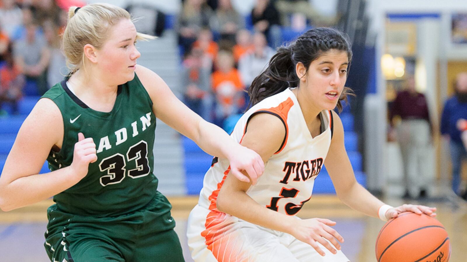 West Liberty-Salem’s Lily Yoder dribbles with pressure from Badin’s Olivia Keene during a Division III district final on Saturday at Springfield. CONTRIBUTED PHOTO BY BRYANT BILLING