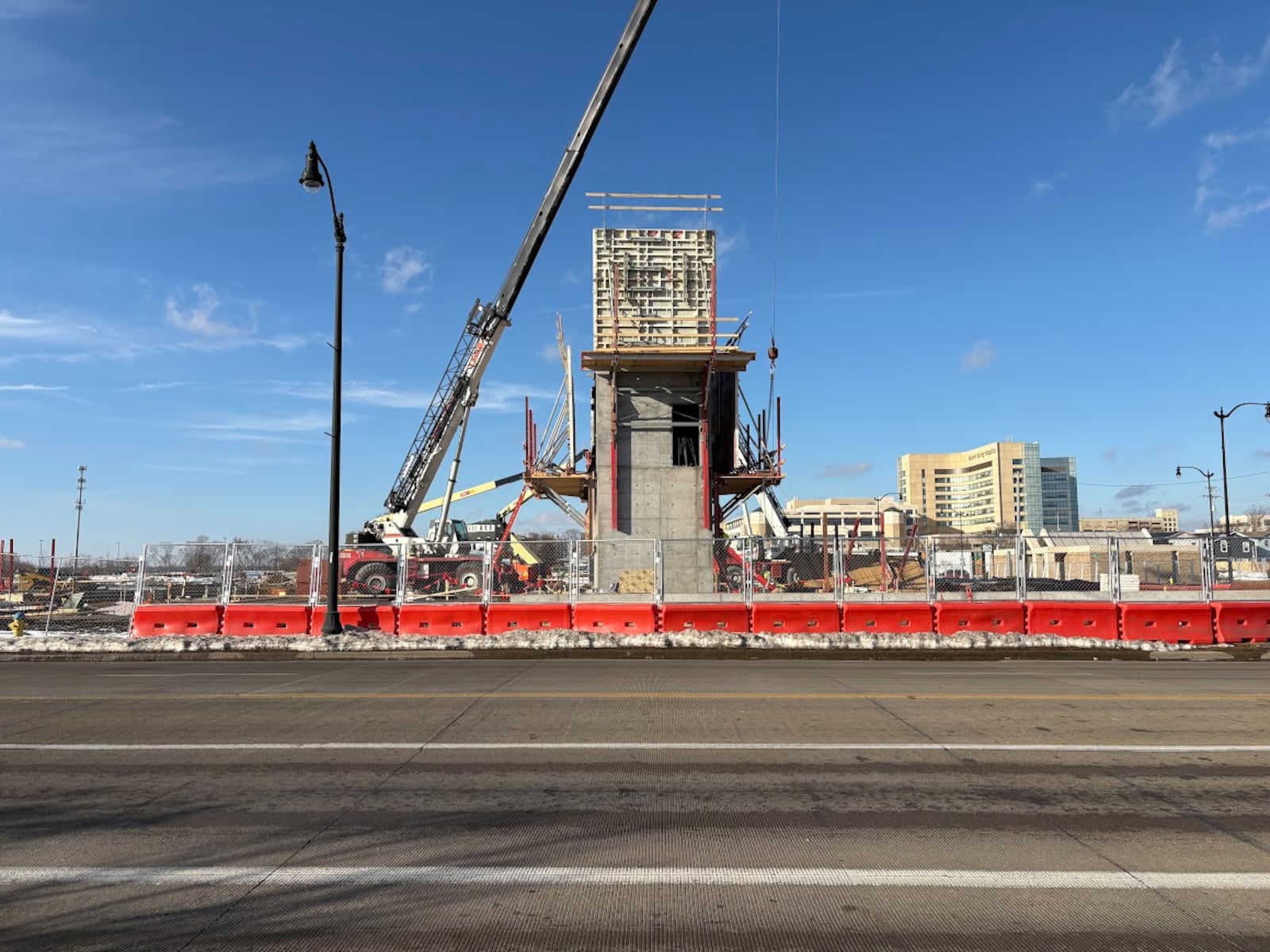 An elevator shaft for what will be the "Think Dayton" building rises just off Stewart Street on a corner of what was the Montgomery County Fairgrounds on Wednesday, Feb. 11, 2026. THOMAS GNAU/STAFF