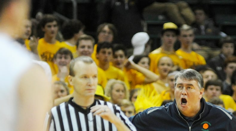 CJ coach Joe Staley discusses a call in a game against rival Alter at WSU’s Nutter Center in 2016. MARC PENDLETON / STAFF
