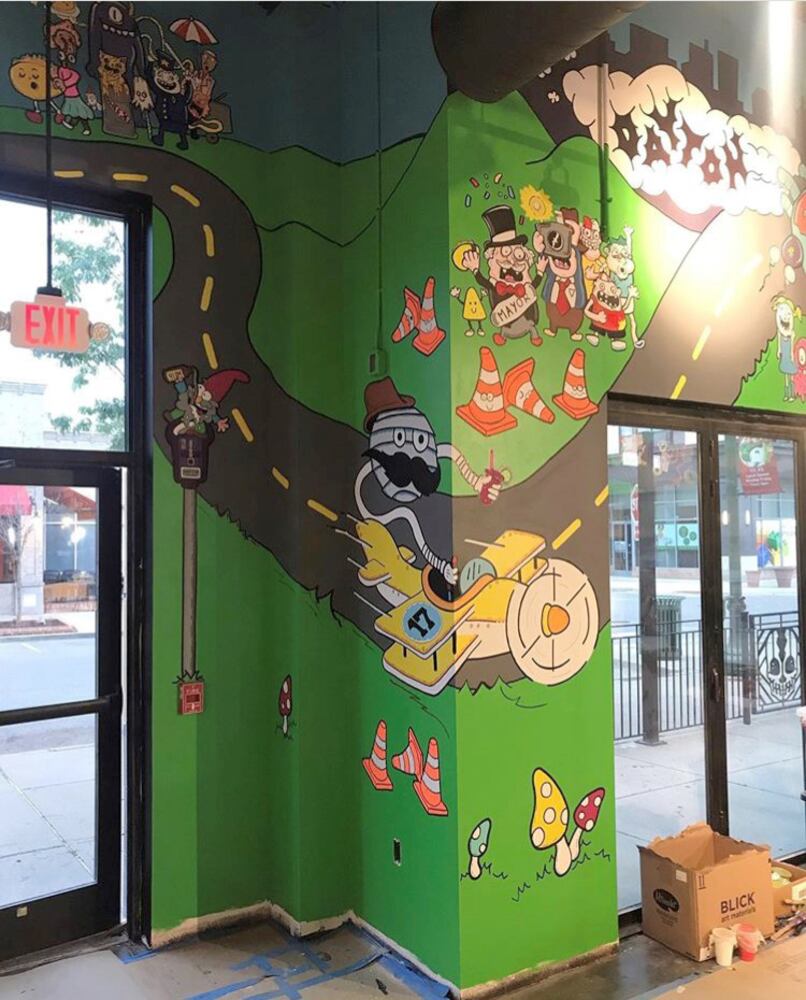 PHOTOS: Wild and wacky murals take over new restaurant at The Greene