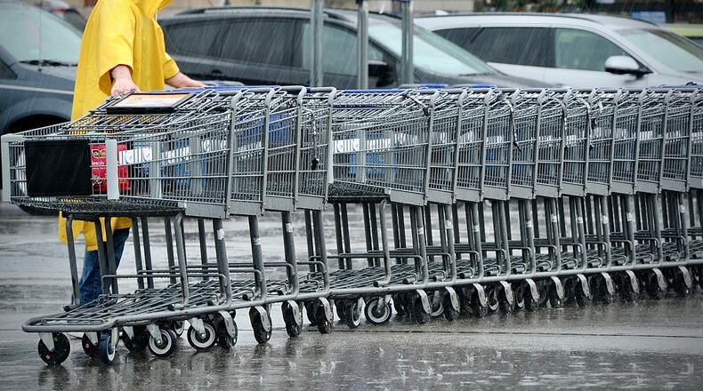 Neither rain nor snow or sleet will stop the return of shopping carts to the Kroger Market Place in Beavercreek, Wednesday, April 5, 2023. MARSHALL GORBY \STAFF
