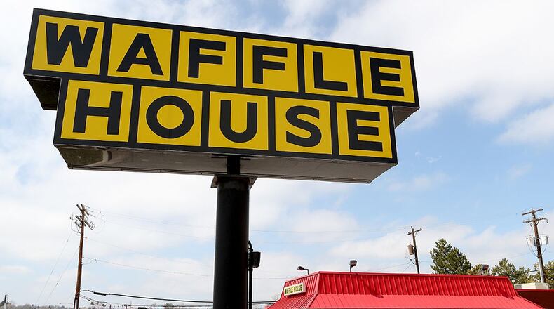 When doors open Monday, employees will be wearing masks. (Matthew Stockman/Getty Images)