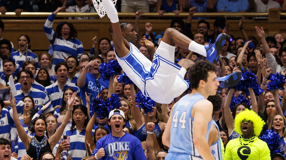 Duke's Dame Sarr (7) dunks during the first half of an NCAA college basketball game against North Carolina in Durham, N.C., Saturday, March 7, 2026. (AP Photo/Ben McKeown)