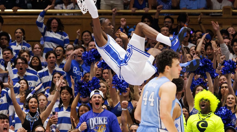 Duke's Dame Sarr (7) dunks during the first half of an NCAA college basketball game against North Carolina in Durham, N.C., Saturday, March 7, 2026. (AP Photo/Ben McKeown)