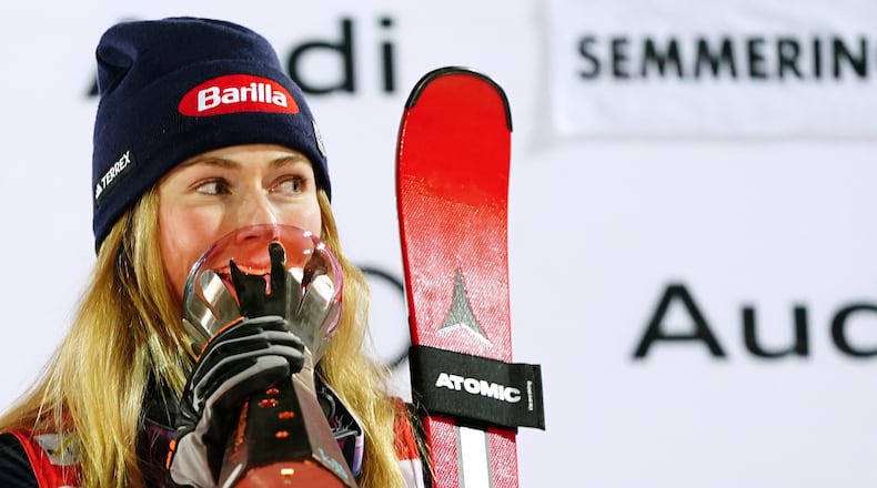 United States' Mikaela Shiffrin, winner of an alpine ski, women's World Cup slalom, poses with the trophy in Semmering, Austria, Sunday, Dec. 28, 2025. (AP Photo/Pier Marco Tacca)