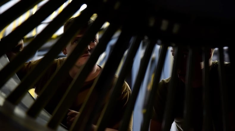 From left, U.S. Air Force Staff Sgt. Tyler Gearhart, a 117th Maintenance Squadron crew chief, and U.S. Air Force Tech. Sgt. David Kennedy, 117 MXS aerospace propulsion flight chief, inspect the inside portion of a KC-135R Stratotanker CFM56 engine on Sept. 8, 2023, at Sumpter Smith Joint National Guard Base, Alabama. (U.S. Air National Guard photo by Staff Sgt. Shelby Thurman)