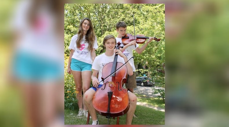 Oakwood triplets organize this year’s Giving Strings Concert on Aug. 11. They are: Eric Powers, sitting with cello, Regina Powers on left and Greg Powers on right with viola. CONTRIBUTED