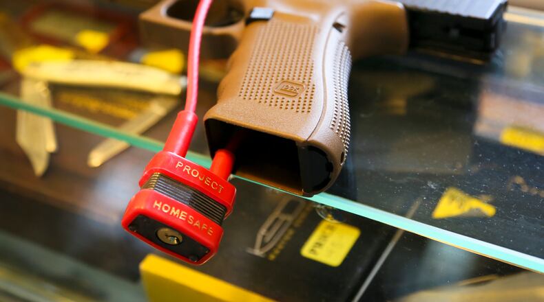 A gun lock on a firearm. GREG LYNCH / STAFF