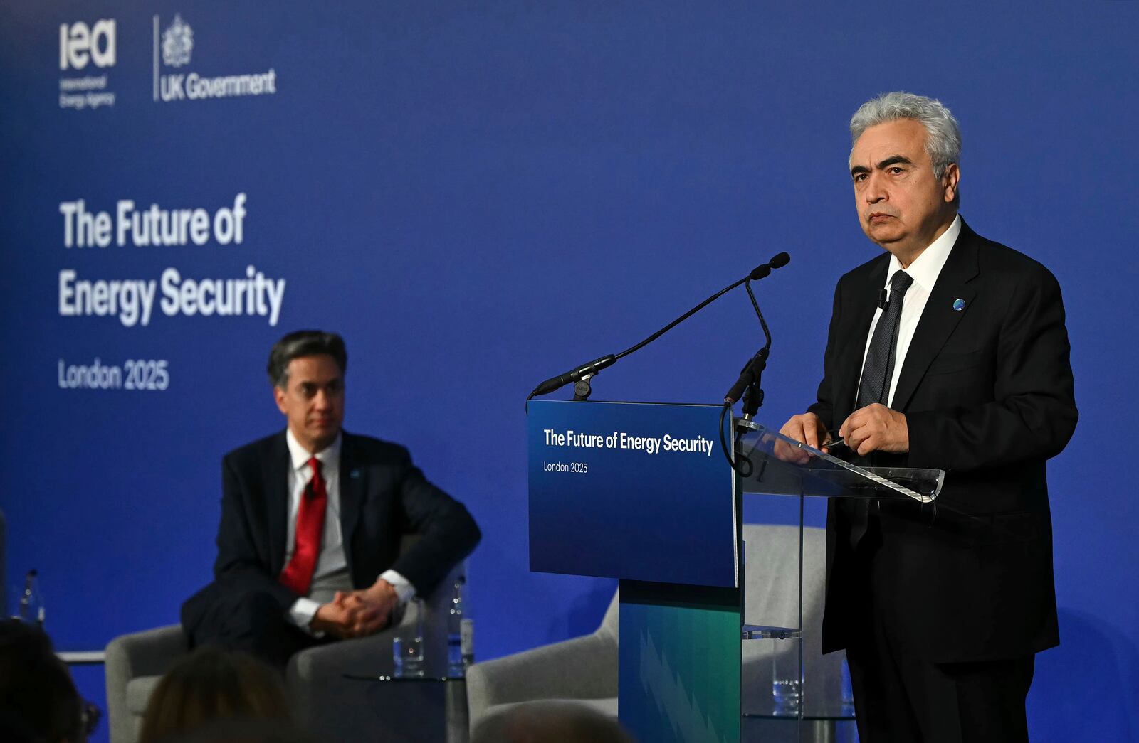Britain's Secretary for Energy Security Ed Miliband looks on as Fatih Birol, Executive Director of the International Energy Agency (IEA) speaks on day one of the International Summit on the Future of Energy Security at Lancaster House in London, Thursday April 24, 2025. (Justin Tallis/Pool via AP)