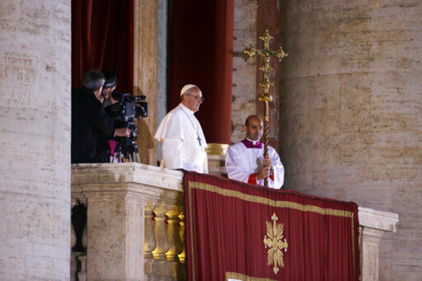 FILE - Argentine Cardinal Jorge Bergoglio, who chose the name of Pope Francis, looks out to the crowd from the central balcony of St. Peter's Basilica after being elected 266th pontiff of the Roman Catholic Church, at the Vatican, Wednesday, March 13, 2013. (AP Photo/Luca Bruno, file)
