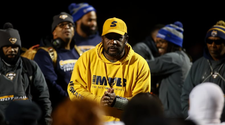 Springfield's Maurice Douglass talks to his team after a victory against Centerville in a Division I, Region 2 playoff game on Friday, Nov. 3, 2023, at Centerville. David Jablonski/Staff