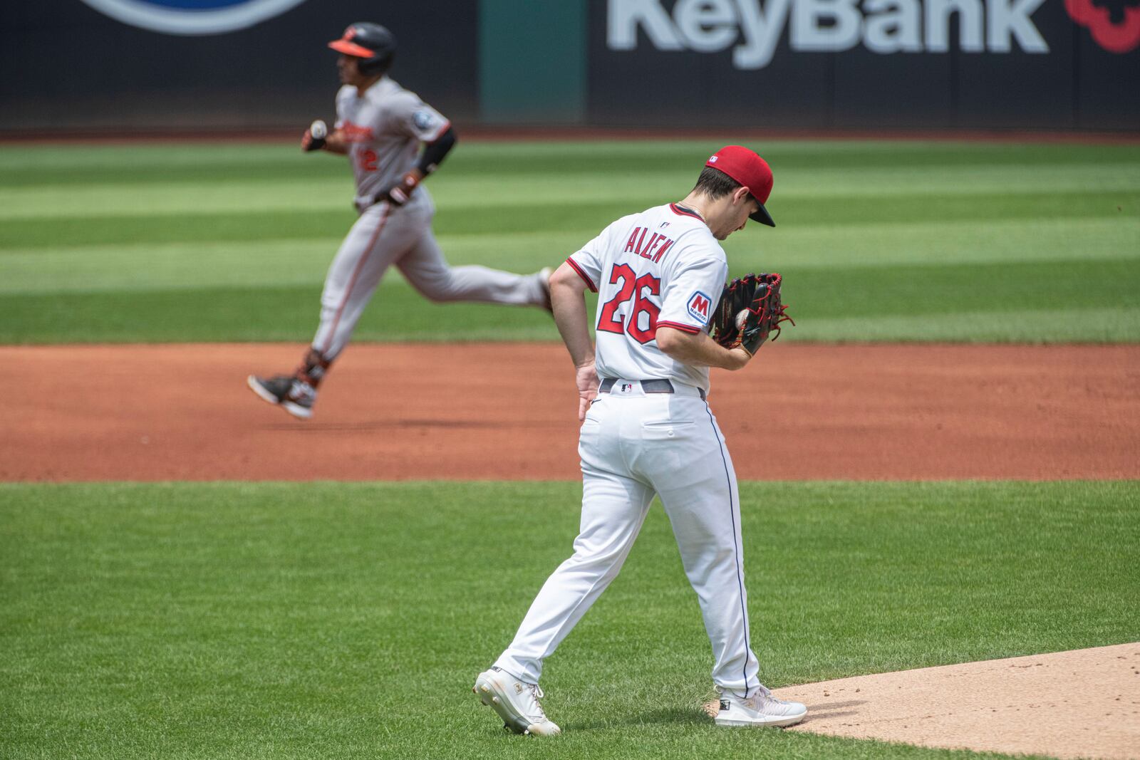 Cleveland Guardians starting pitcher Logan Allen (26) turns his back as Baltimore Orioles' Ramon Laureano rounds the bases after hitting a two-run home run during the first inning of a baseball game, Thursday, July 24, 2025, in Cleveland. (AP Photo/Phil Long)