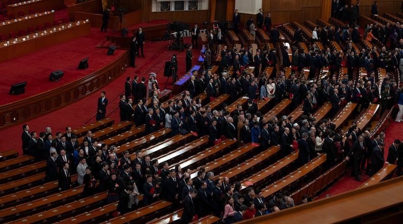 Delegates leave after the closing ceremony of the Chinese People's Political Consultative Conference (CPPCC), in Beijing, Wednesday, March 11, 2026. (AP Photo/Ng Han Guan)