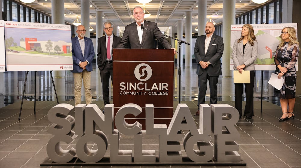 Sinclair Community College President Steve Johnson speaks during a news conference on campus on Thursday, Nov. 20. The university announced it is spending $30 million to remodel Building 8, its former field house, and create a future technology center. BRYANT BILLING/STAFF