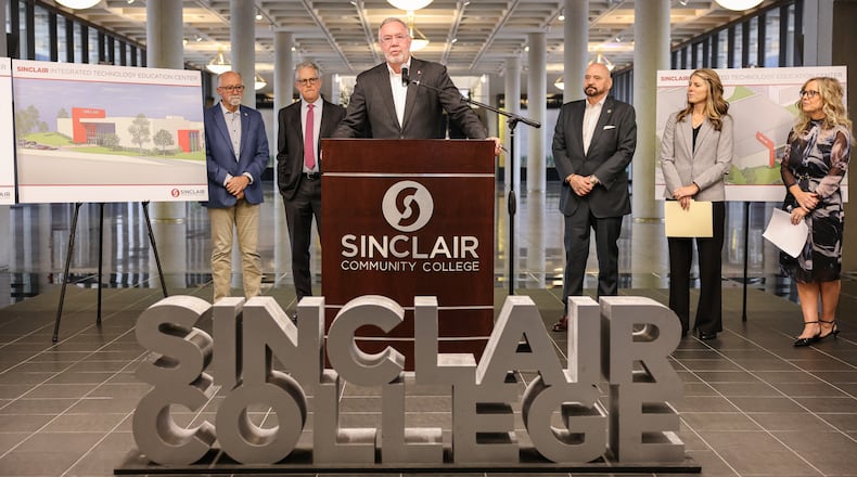 Sinclair Community College President Steve Johnson speaks during a news conference on campus on Thursday, Nov. 20. The university announced it is spending $30 million to remodel Building 8, its former field house, and create a future technology center. BRYANT BILLING/STAFF