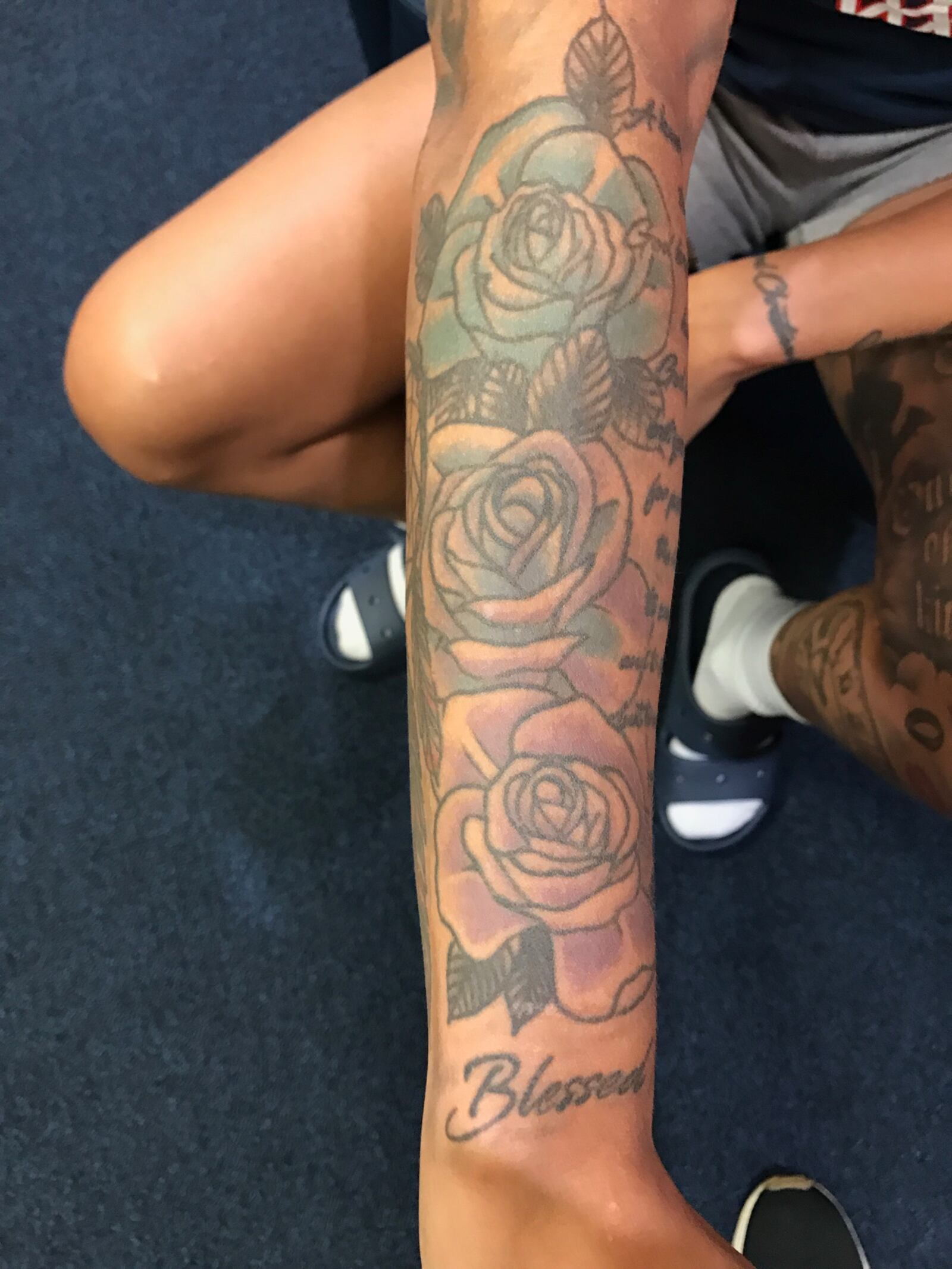 The three flowers tattoo on the right arm of Rikki Harris represent her mom (the purple flower) at the bottom, her grandmother (the blue flower) at the top and herself (a combination of the two colors) in the middle. Tom Archdeacon/CONTRIBUTED