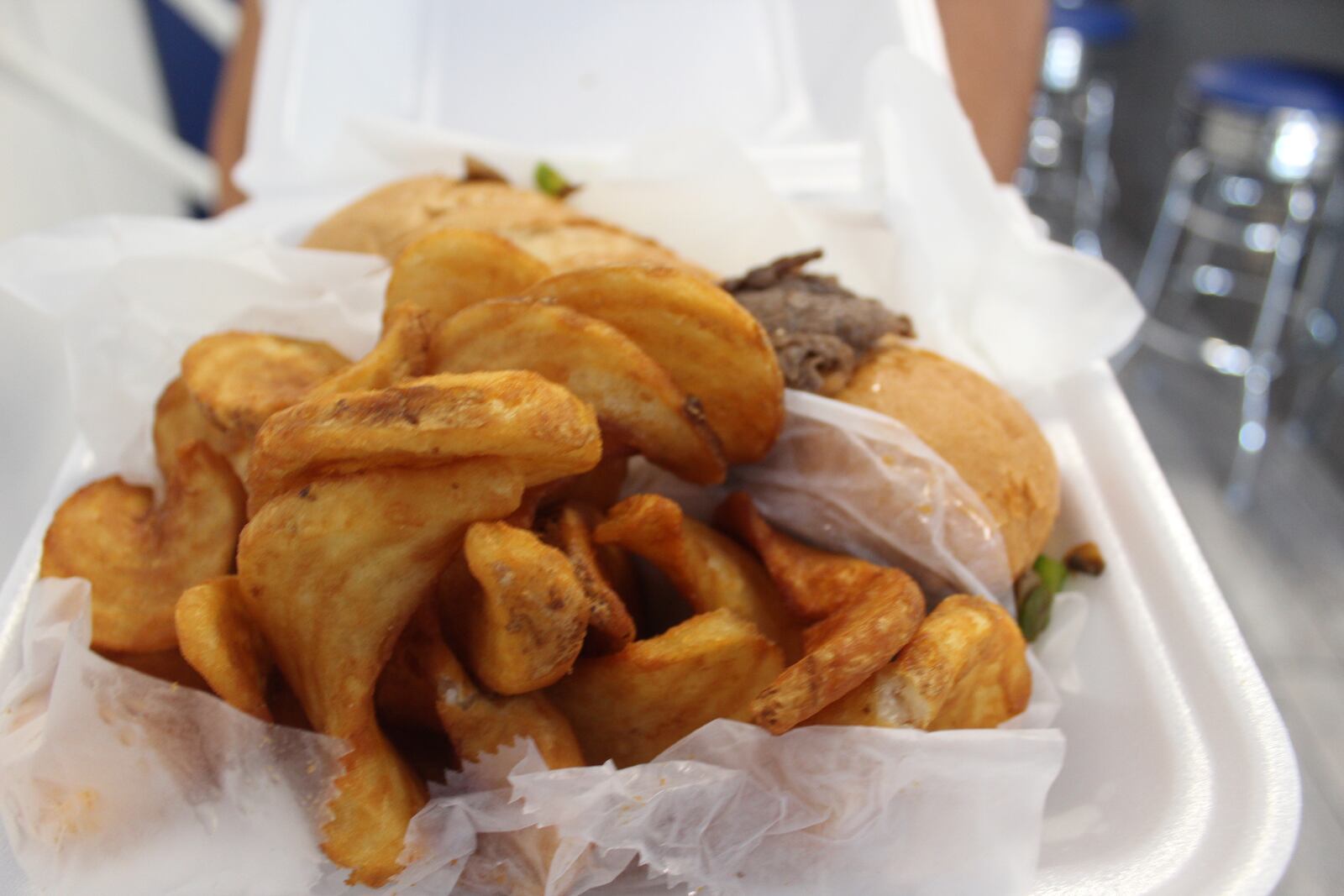 Oregon District resident Guy Fragmin sells West Virginia-style pepperoni rolls at 416 Diner.  It also sells a variety of sandwiches like this cheese steak hoagie pictured with potato twists.