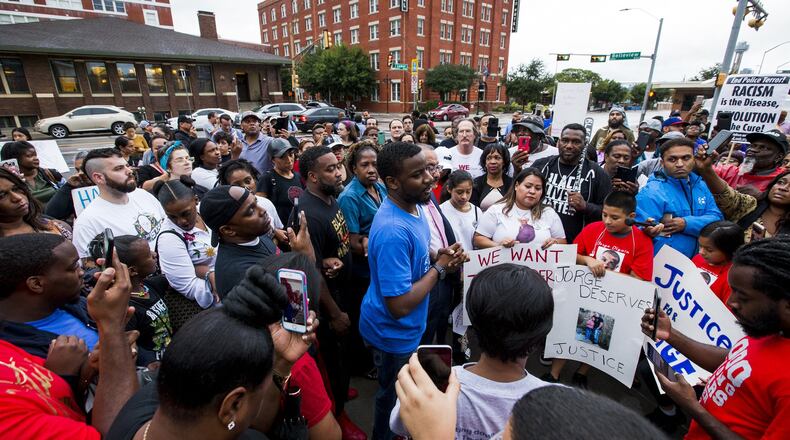 Dominique Alexander talks to protesters during a protest over the shooting of Botham Shem Jean on Monday, Sept. 10, 2018 at the Jack Evans Police Headquarters in Dallas, Texas. (Shaban Athuman/Dallas Morning News/TNS)