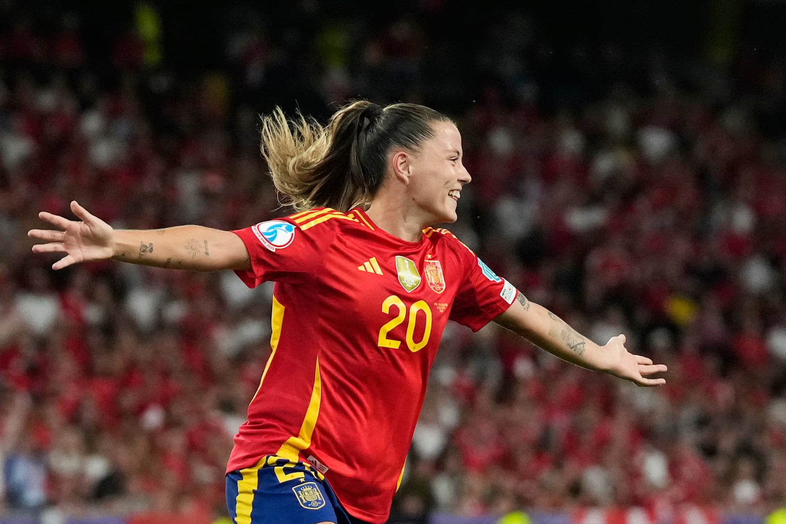 Spain's Claudia Pina celebrates after scoring her side's second goal during the Women's Euro 2025 quarterfinals soccer match between Spain and Switzerland at Stadion Wankdorf in Bern, Switzerland, Friday, July 18, 2025. (AP Photo/Alessandra Tarantino)