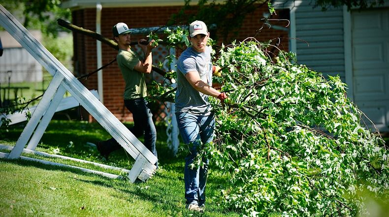 Students from Greenville High School came out to help neighbors around the area clean up their yards after strong storms hit the area Tuesday night, May 7, 2024. MARSHALL GORBY/STAFF