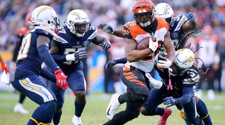 CARSON, CA - DECEMBER 09: Joe Mixon #28 of the Cincinnati Bengals is chased down by Jahleel Addae #37, Desmond King #20 and Jatavis Brown #57 of the Los Angeles Chargers during the fourth quarter in a 26-21 Chargers win at StubHub Center on December 9, 2018 in Carson, California. (Photo by Harry How/Getty Images)