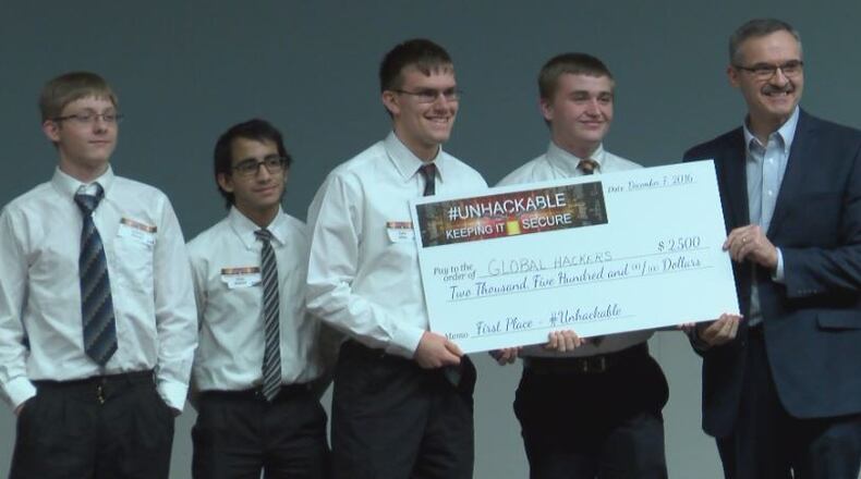 Springboro team “Global Hackers Network of the Worlds” was presented the winning $2500 check by AT&T’s Mark Romito.