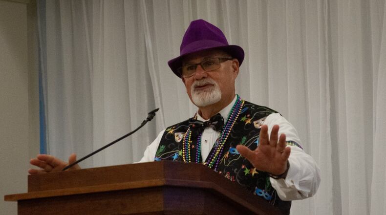 Chris Stanley, executive director of the Fisher-Nightengale Houses, at the "Beads and Bling – It’s a Mardi Gras Thing” fundraiser in August at the Dayton Masonic Center. Contributed