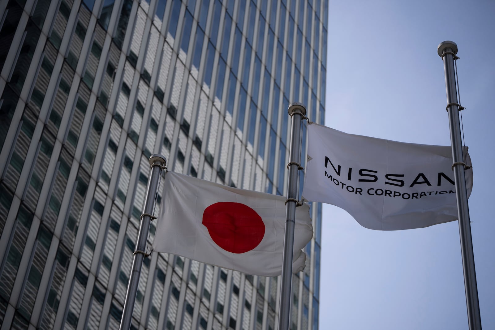 Nissan signage at Nissan headquarters in Yokohama, Tuesday, May 13, 2025. (AP Photo/Louise Delmotte)