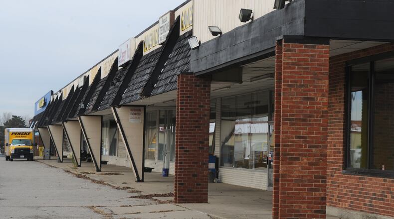 The city of Huber Heights has plans to tear down the Marian shopping center once all tenants have left. MARSHALL GORBY\STAFF