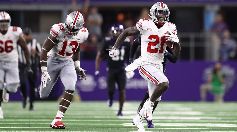 ARLINGTON, TX - SEPTEMBER 15: Parris Campbell #21 of the Ohio State Buckeyes runs for a touchdown against the TCU Horned Frogs in the third quarter during The AdvoCare Showdown at AT&T Stadium on September 15, 2018 in Arlington, Texas. (Photo by Ronald Martinez/Getty Images)