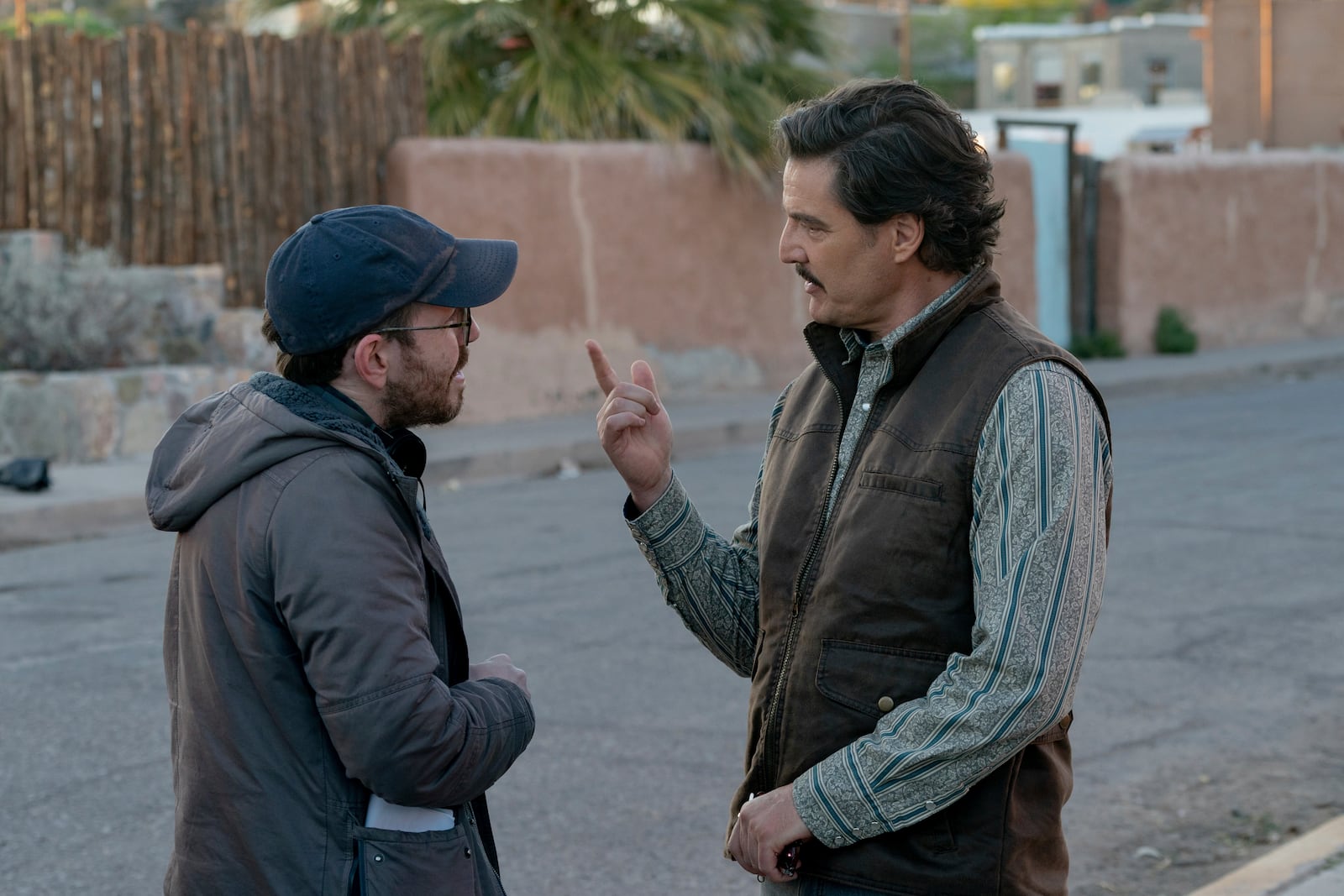 This image released by A24 shows director Ari Aster, left, and Pedro Pascal filming "Eddington." (Richard Foreman/A24 via AP)