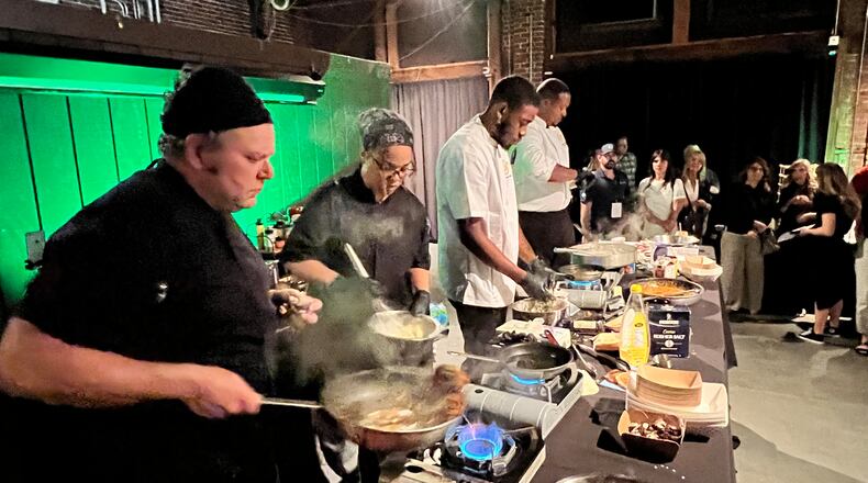 The final round of the Diced in Dayton Chef's Challenge saw the team from Corner Kitchen led by executive chef Gavin St. Denis (far left), face off agains the team from Rich Taste Catering led by chef and owner Gerald Richardson (far right). PHOTO BY ALEXIS LARSEN