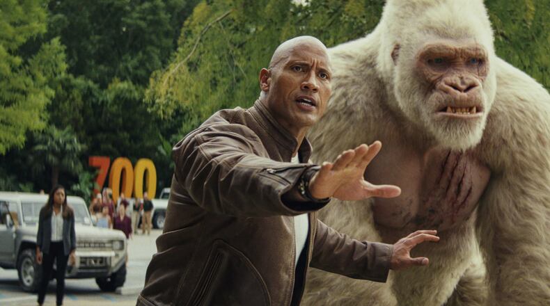 Dwayne Johnson (left) as Davis Okoye and Jason Liles as George in “Rampage.” Contributed by Warner Bros. Pictures