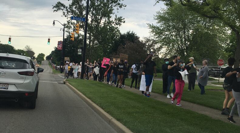 A few hundred people marched from Stubbs Park on Spring Valley Road up to Ohio 725 in Centerville on June 1, 2020, to protest the death of George Floyd by police in Minneapolis. JIM BEBBINGTON / STAFF