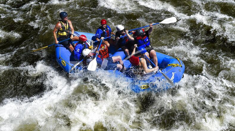 FILE - In this June 18, 2014, file photo, rafters navigate high water and big rapids in Bighorn Sheep Canyon on the Arkansas River near Colorado Springs, Colo. Despite a severe drought across the Southwestern United States, there should be plenty of water this year for rafters and anglers in the Arkansas, one of the nation's most popular mountain rivers. State and federal officials say water from melting snow will surge down the river thanks to a surprisingly wet winter in the towering peaks of the Sawatch Range where the river begins. (Michael Ciaglo/The Colorado Springs Gazette via AP, File)